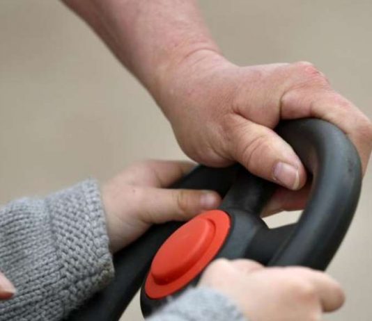 Child driving pedal car on the street: the parents?