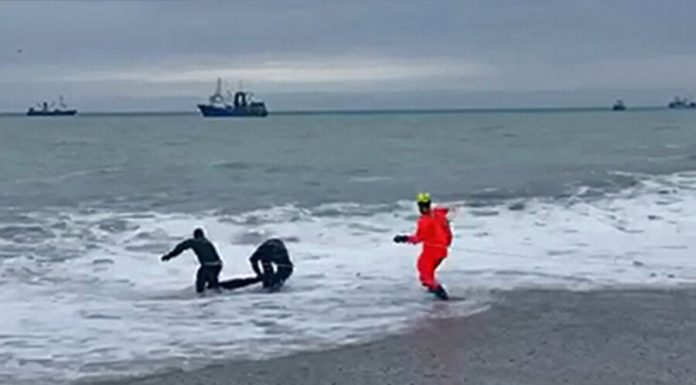 Located on the pier of tourists washed away by a wave in the Crimea