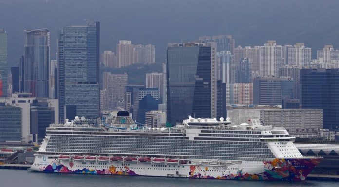 Passengers standing on a quarantine in Hong Kong the ship was allowed to leave the ship