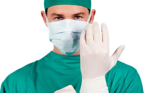 The doctor called the error protection gloves from coronavirus