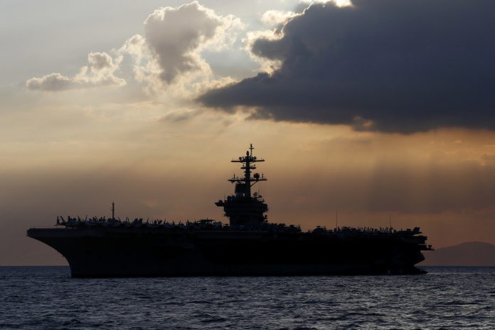 The Pentagon has denied the team infected a U.S. aircraft carrier in the evacuation